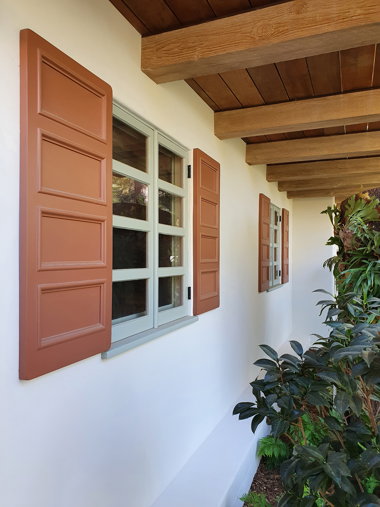 Exterior repaint featuring warm neutral siding and crisp white trim on a NJ residence