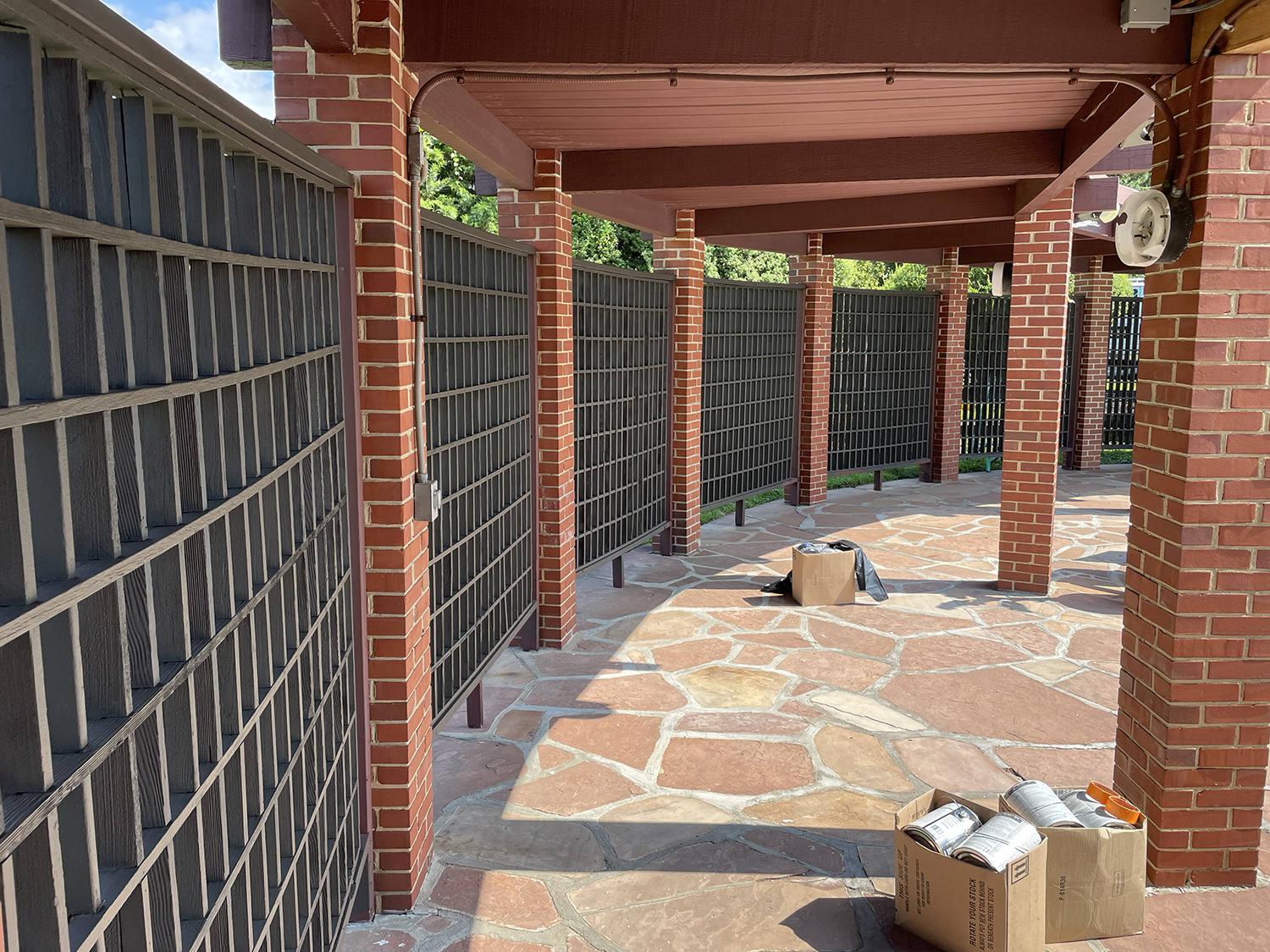 Coastal home exterior with painted cedar shingles and hand-brushed trim