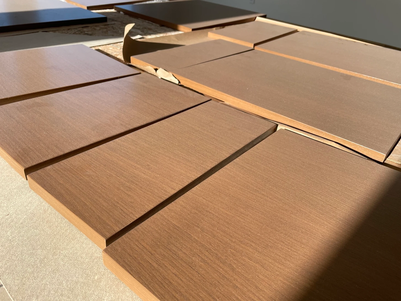 Refinished exterior wood deck with penetrating stain in warm cedar tone