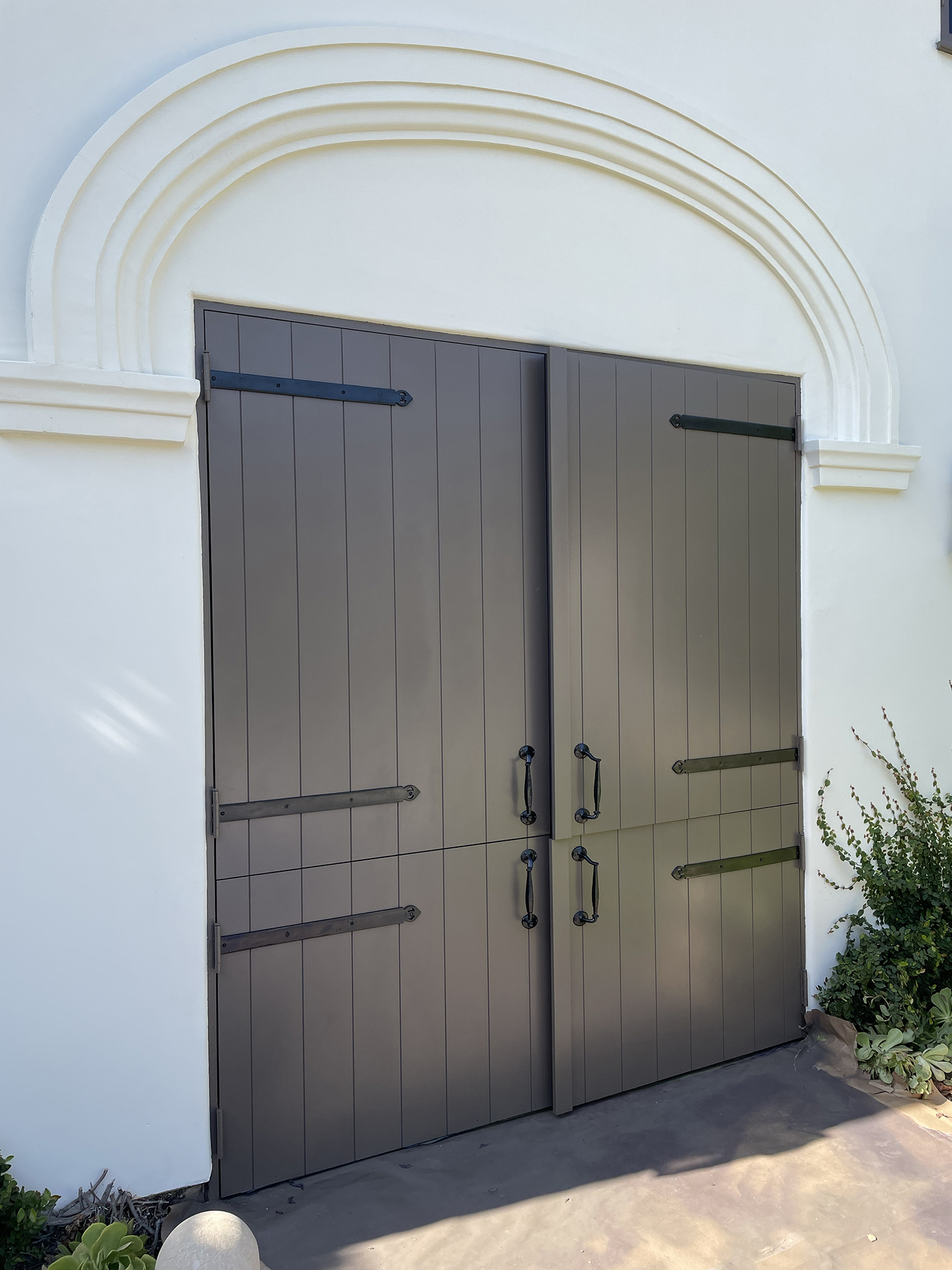 Bold color front door repaint contrasting against white shingle siding